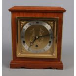 An Elliot mantle clock by Burrell Sheffield featuring eight day lever Westminster and Whittington