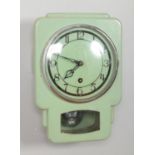 A Smiths Enfield art deco pale green metal wall clock with key.