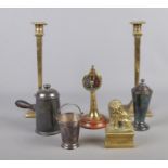 A collection of assorted metalwares, to include a pair of candlesticks, brass paperweight, miniature