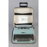 An Olivetti Lettera 32 portable typewriter, in carry case.