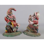 A pair of painted cast iron door stops, formed as Punch and Judy. Tallest 30cm.