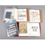 Two partly completed Stanley Gibbons world stamp albums, together with an album of stamps