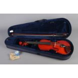 A Stentor Student I half-size violin with bow, case and accessories.