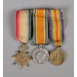 Miniature WWI service medals on pin back mount. Includes 1914-15 star, British War medal and Victory