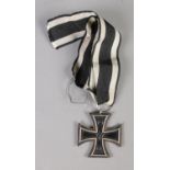 A WWI Prussian Iron Cross with black and white ribbon.