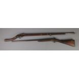 Two Nineteenth Century percussion cap pit rifles; including Eastern example with bone inlay to the