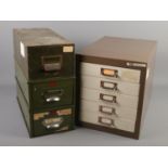 Four metal filing drawers. Includes two Veteran Series military green coloured single drawer