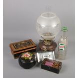A vintage Castrol pint bottle along with two metal cash boxes/tins, an oil lamp and a barge ware