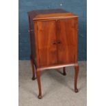 A Dulcetto mahogany gramophone cabinet featuring fitted interior and hinged top.