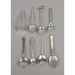 Seven silver spoons, including mother of pearl handled example, and one silver pusher. Hallmarks