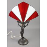 An art deco style figural table lamp. Formed as a female figure holding a fan. (45cn)