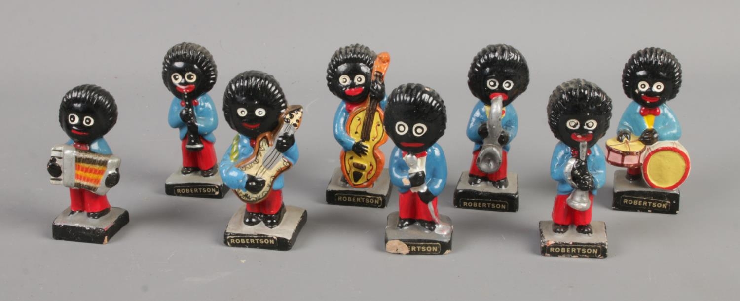 Eight Robertson Golly musical band figures.