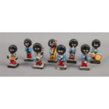 Eight Robertson Golly musical band figures.