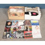 Two boxes of single records. To include Shakin Stevens, Status Quo, Ottawan, KWS and OMD etc.