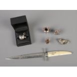 A silver bladed letter opener in the form of a dagger stamped Edwige 1921 to hilt (Assayed