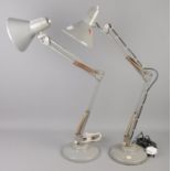 A pair of Thousand & One Ltd anglepoise desk lamps.