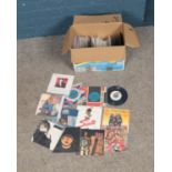 A box of approx. 150 singles of mostly rock and pop examples. To include Rick Astley, Jason Donovan,
