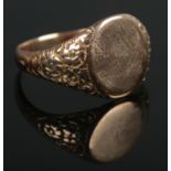 A 9ct Gold signet ring, assayed in Chester. With blank cartouche and part floral decoration to band.
