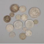 A quantity of international coins, including silver and half-silver examples, to include 1935 crown,