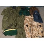 A quantity of military clothing and uniform. Includes RAF cap, desert camouflage, etc.