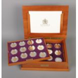 The Royal Mint Queen Elizabeth II Golden Jubilee collection of 24 silver proof coins.