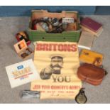 A box of collectables. Includes leather cartridge satchel, clock work toy, Smiths Empire pocket