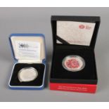 Two silver proof five pound commemorative coins including Royal Mint Remembrance Day 2016 Alderney