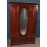 An Edwardian inlaid mahogany mirror front wardrobe. (198cm x 131cm)