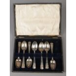A cased set of seven George V silver teaspoons commemorating the silver jubilee. Assayed London 1934