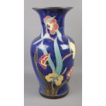 A painted ceramic floor vase featuring floral decoration. Approx. 52cm tall.