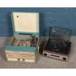 An Ear portable record player along with one other record player.
