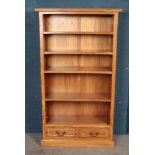 A modern open fronted bookcase with two lower drawers featuring inlay decoration. Approx. dimensions