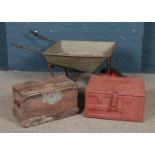 A galvanised metal wheelbarrow, together with a tin trunk dated 1944 and hinged wooden box.