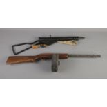 A replica bolt action machine gun along with replica tommy gun featuring Thompson marked circular