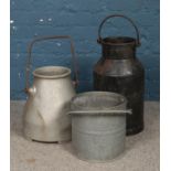 Two metal milk churns, labelled for Gascoignes and WN Frefborough, Melton Mobray, together with a
