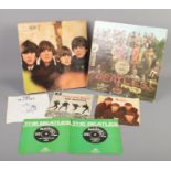 A small quantity of Beatles records. Includes Sgt Pepper LP, Twist and Shout single, etc.