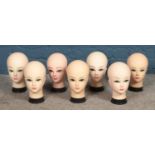 A box of vintage mannequin display heads.