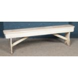 A painted pine bench. 152cm long.