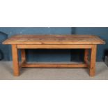 A large pine refectory dining table, with central stretcher. Height: 78cm, Width: 212cm, Depth: