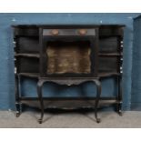 A Victorian ebonised empire cabinet base/sideboard. Glass missing on door.