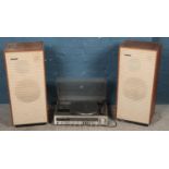 A Sanyo Hi-fi stereo music system along with two speakers. Model DXT 5406K.