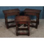 Three oak small occasional tables.