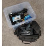 A box of photographic equipment. Includes Hitachi E24E video camera and various accessories.