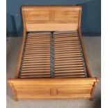 An oak double bed frame. Height: 110cm, Width: 159cm, Length: 227cm. Missing one support for slatted