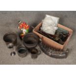 A box of metalwares. Includes copper planters, painted cast iron doorstop, silver plated cutlery