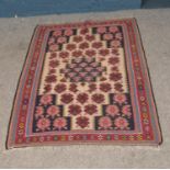 A Senneh Kilim rug with fringe detailing. Approx. dimensions 148cm x 110cm.