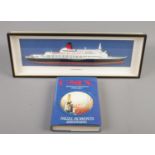 A framed diorama of Queen Elizabeth 2 along with a signed copy of C-Six by Nigel Roberts (