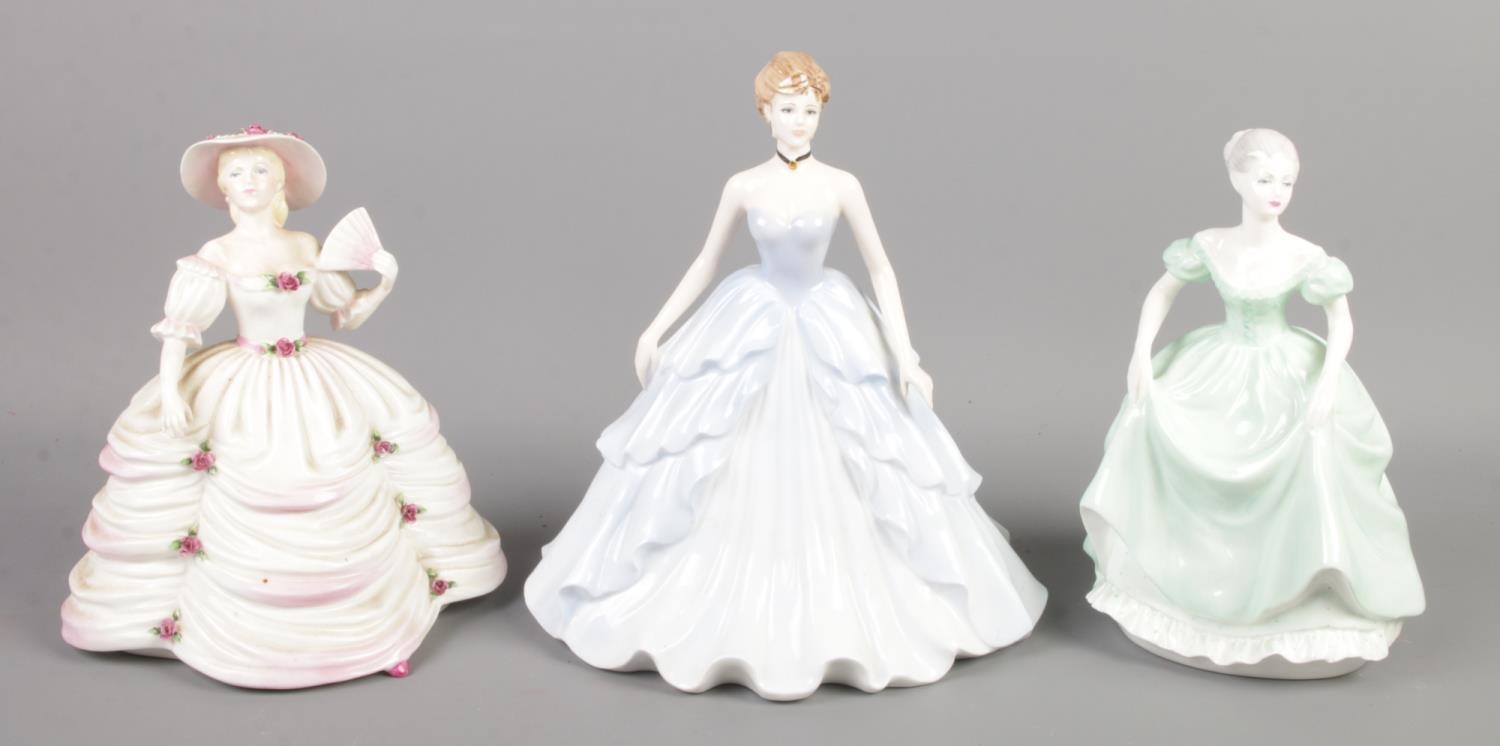 Three Coalport ceramic figures; Evening Elegance, Southern Belle and Henrietta. Chip to one flower