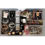 A large box of assorted costume jewellery, to include necklace and earring suites, beaded necklaces,