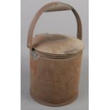 A local metal lidded bucket with swing handle. H.BAKER 8 MORTHEN ROAD, WICKERSLEY.